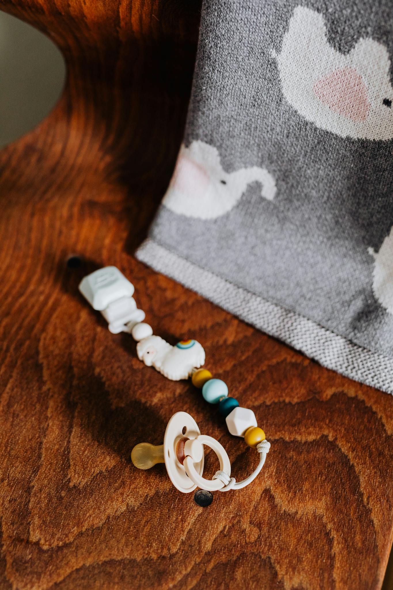 Close Up Of A Baby Pacifier And Beaded Close up of a baby pacifier and beaded
