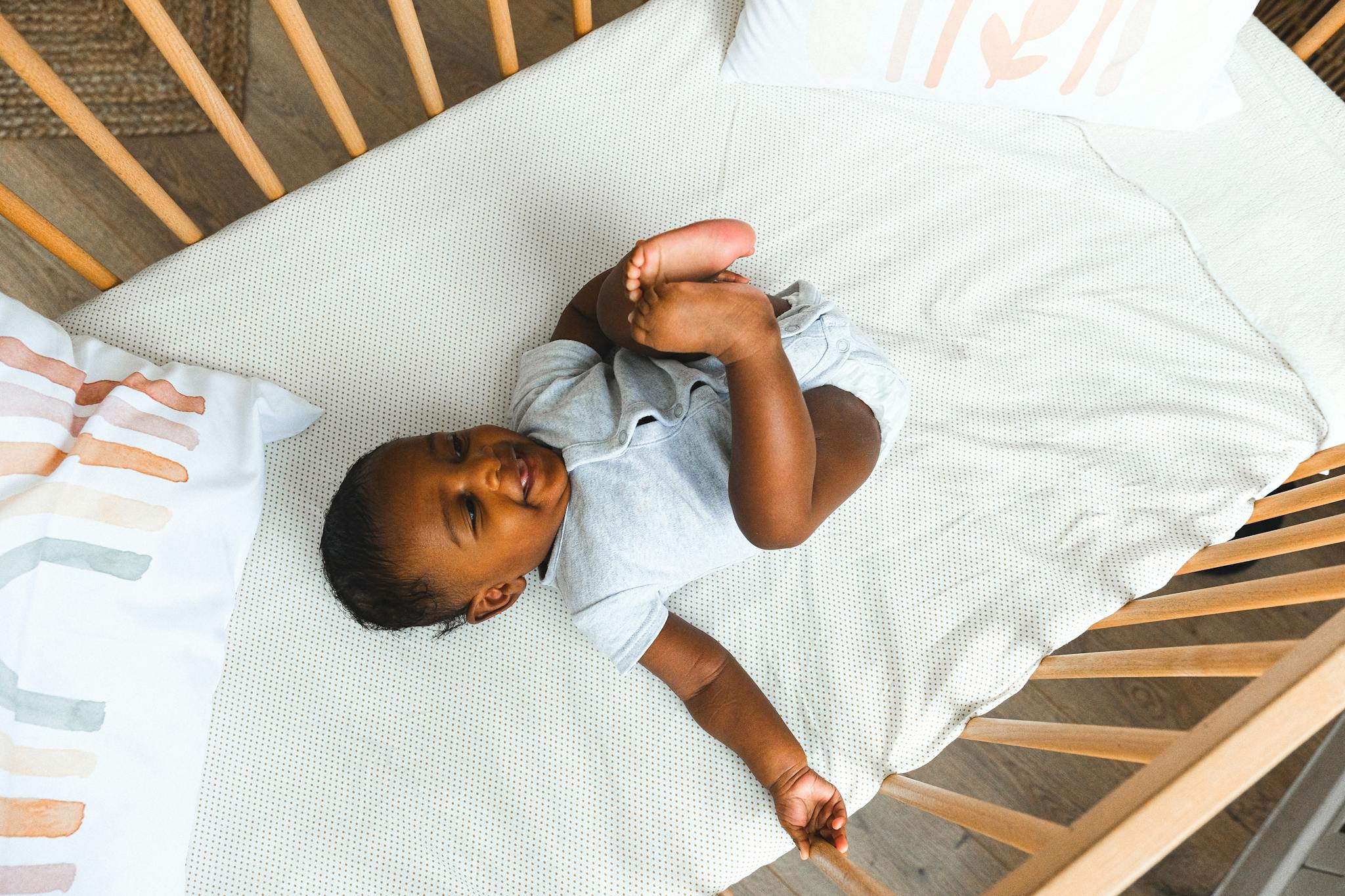 Cute Baby Lying In Crib Smiling And Cute baby lying in crib smiling and