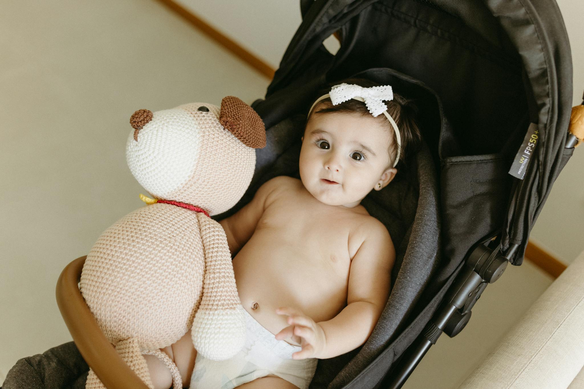 Cute Baby With A Knitted Teddy Bear Cute baby with a knitted teddy bear