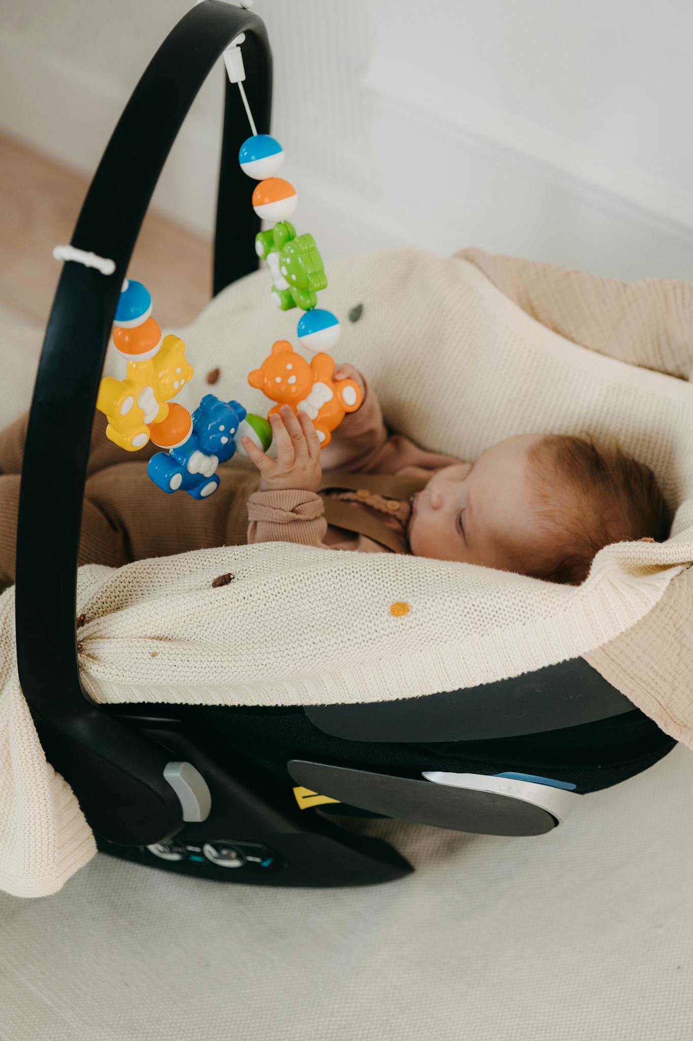 Infant In A Cozy Car Seat Playing Infant in a cozy car seat playing